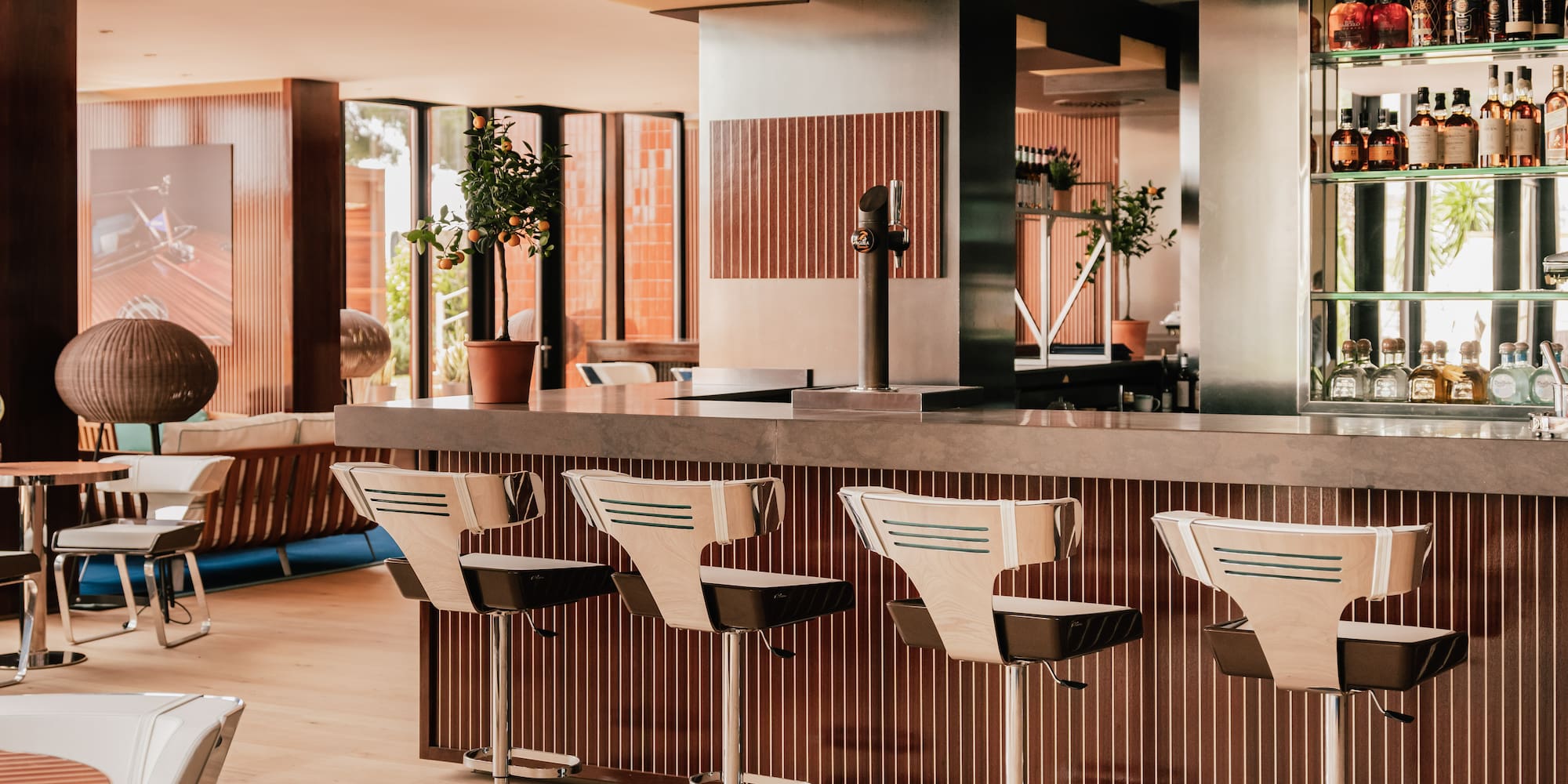 a bar with chairs in a room