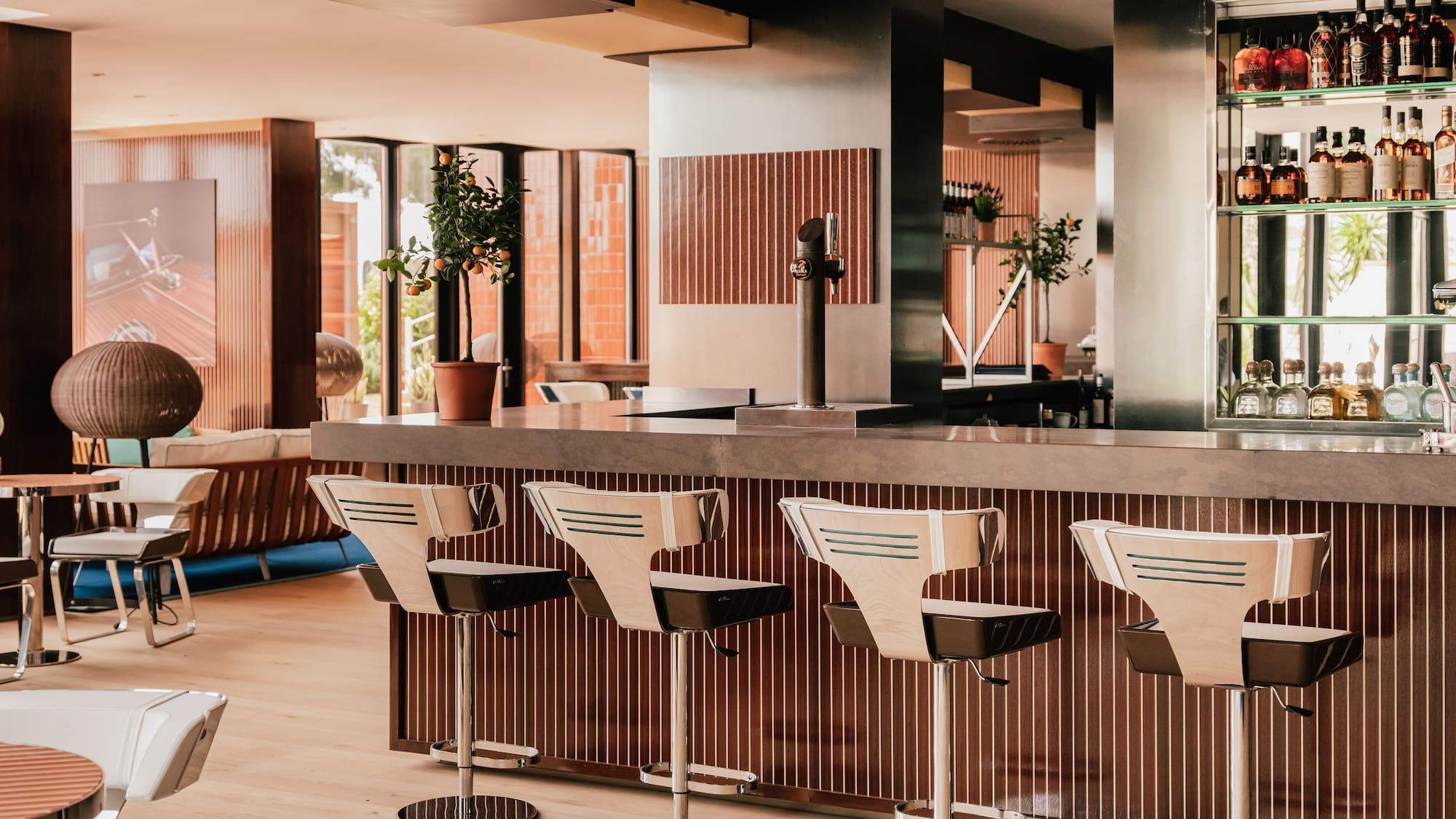 a bar with chairs in a room
