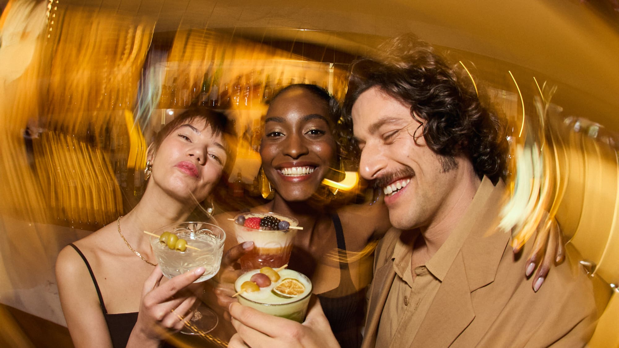 a group of people holding drinks