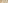 Elegant wedding table decor with white flowers, candles, and gold cutlery.