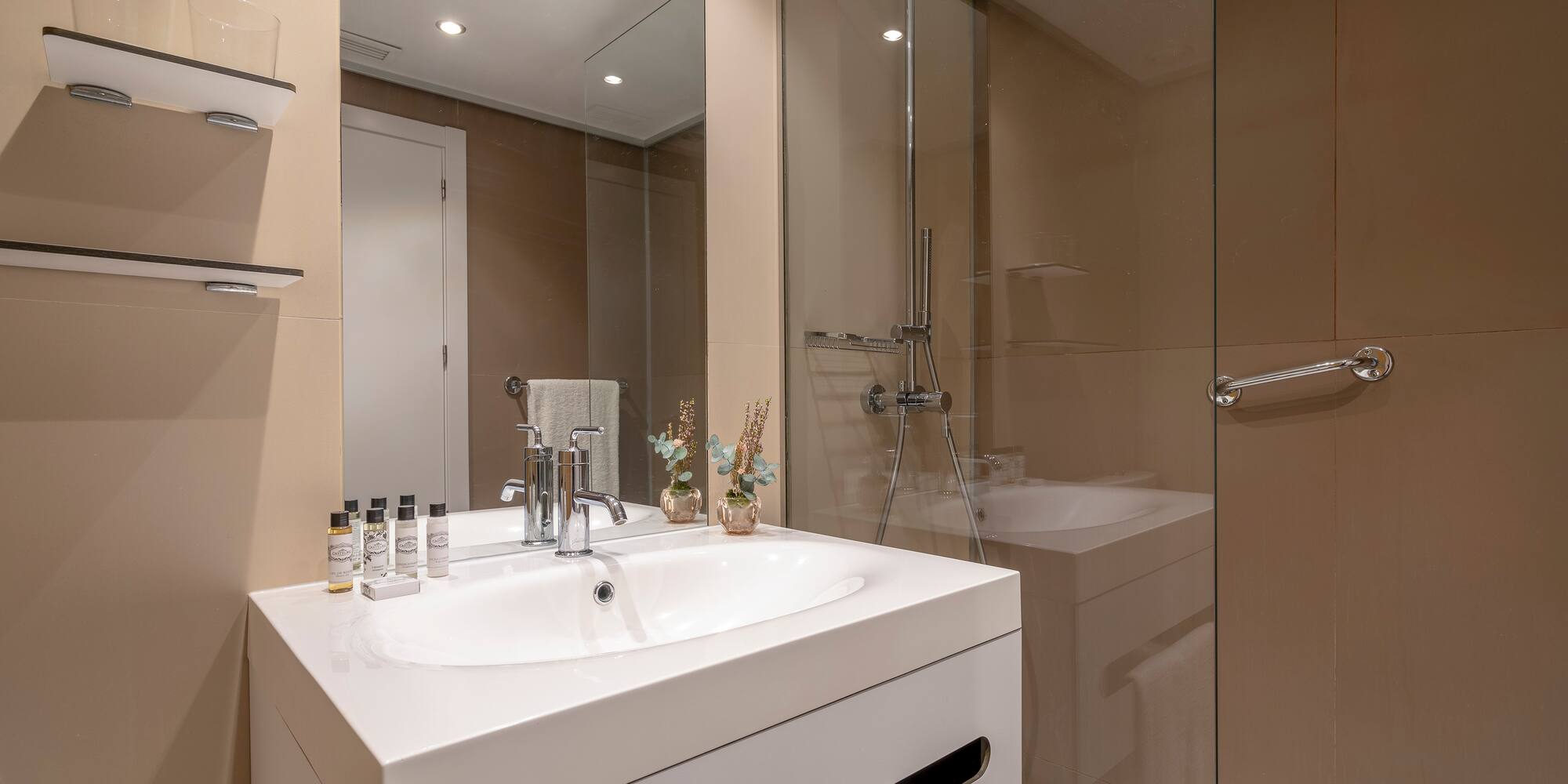 a bathroom with a shower and sink