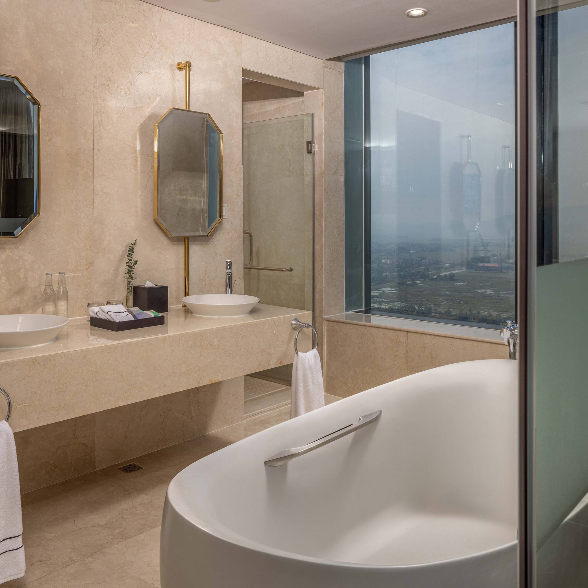 a bathroom with a tub and sinks