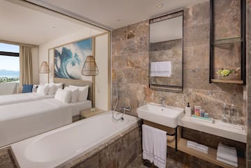 a bathroom with a bed and a bathtub