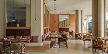 a restaurant with tables and chairs