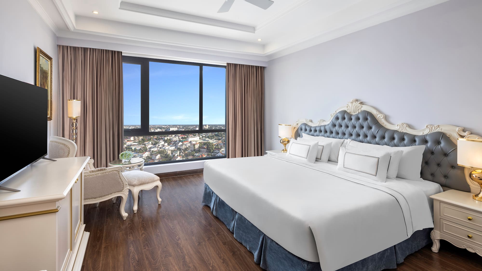 a bedroom with a large window and a large bed