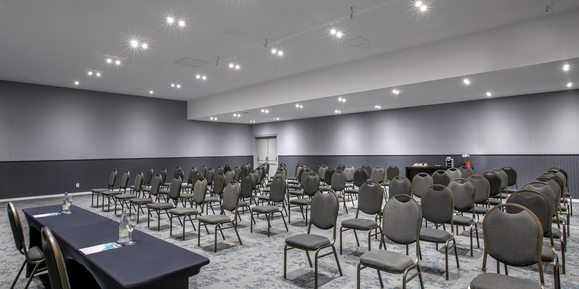 a room with many chairs and tables