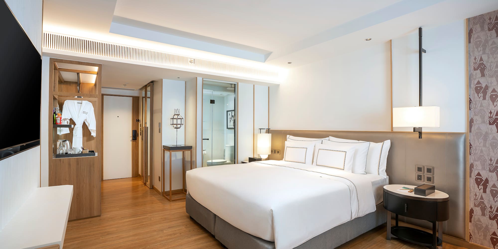 a room with a bed and a wood floor