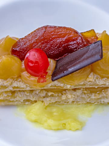a plate of food on a white surface