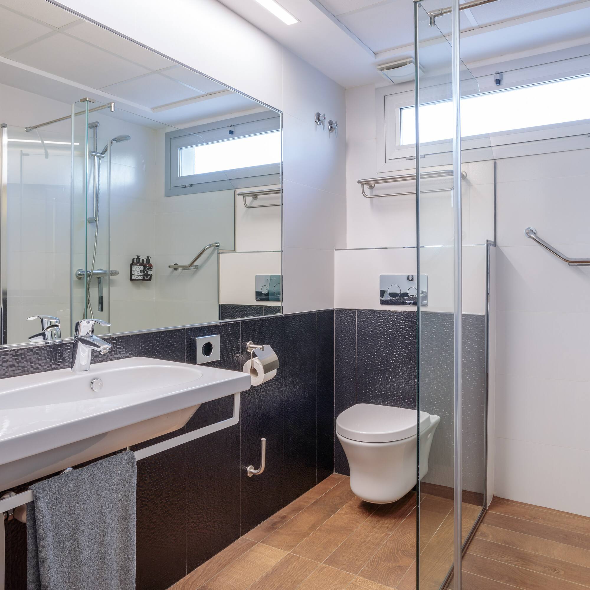 a bathroom with a sink and shower