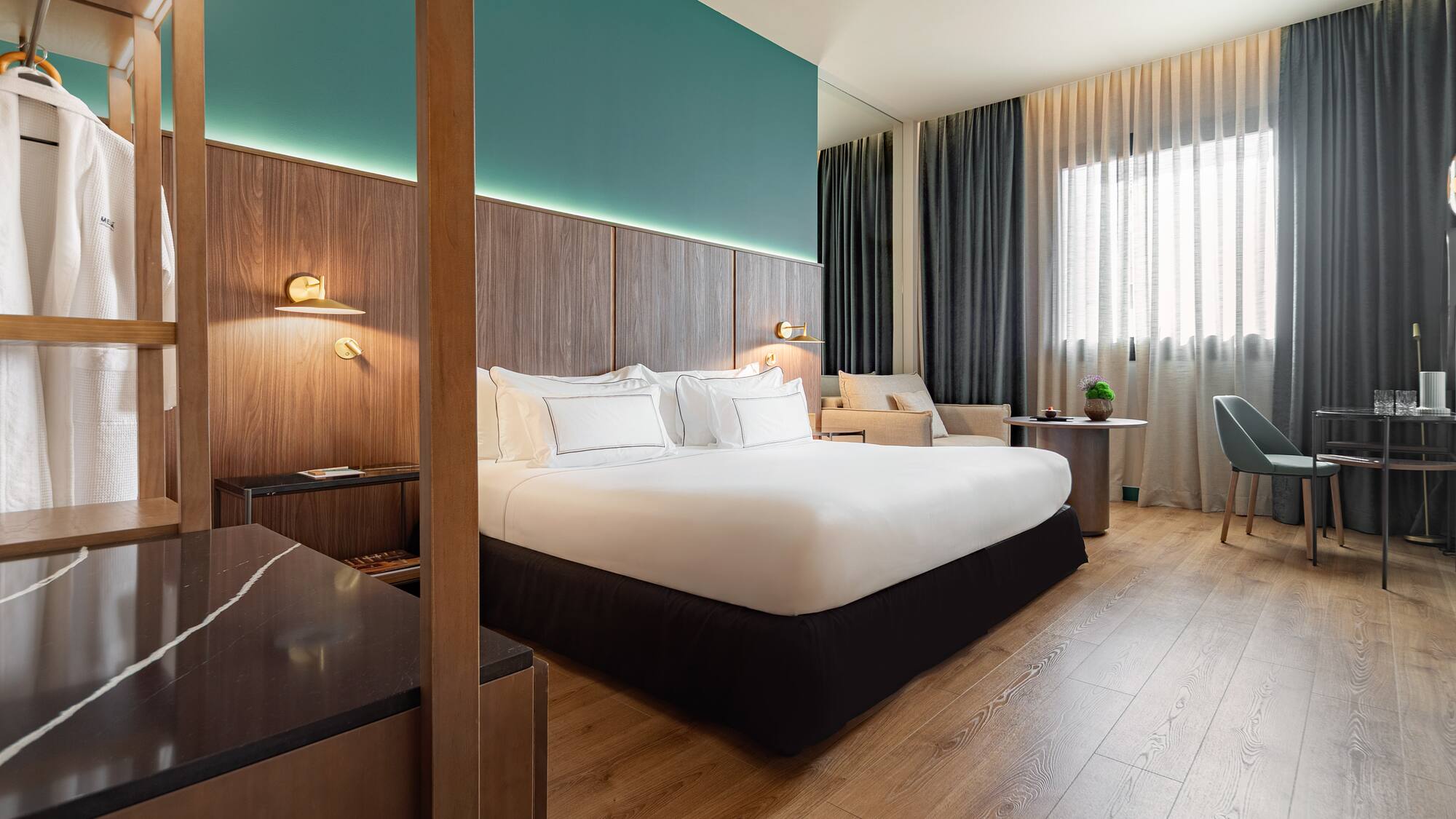 a room with a bed and a wood floor