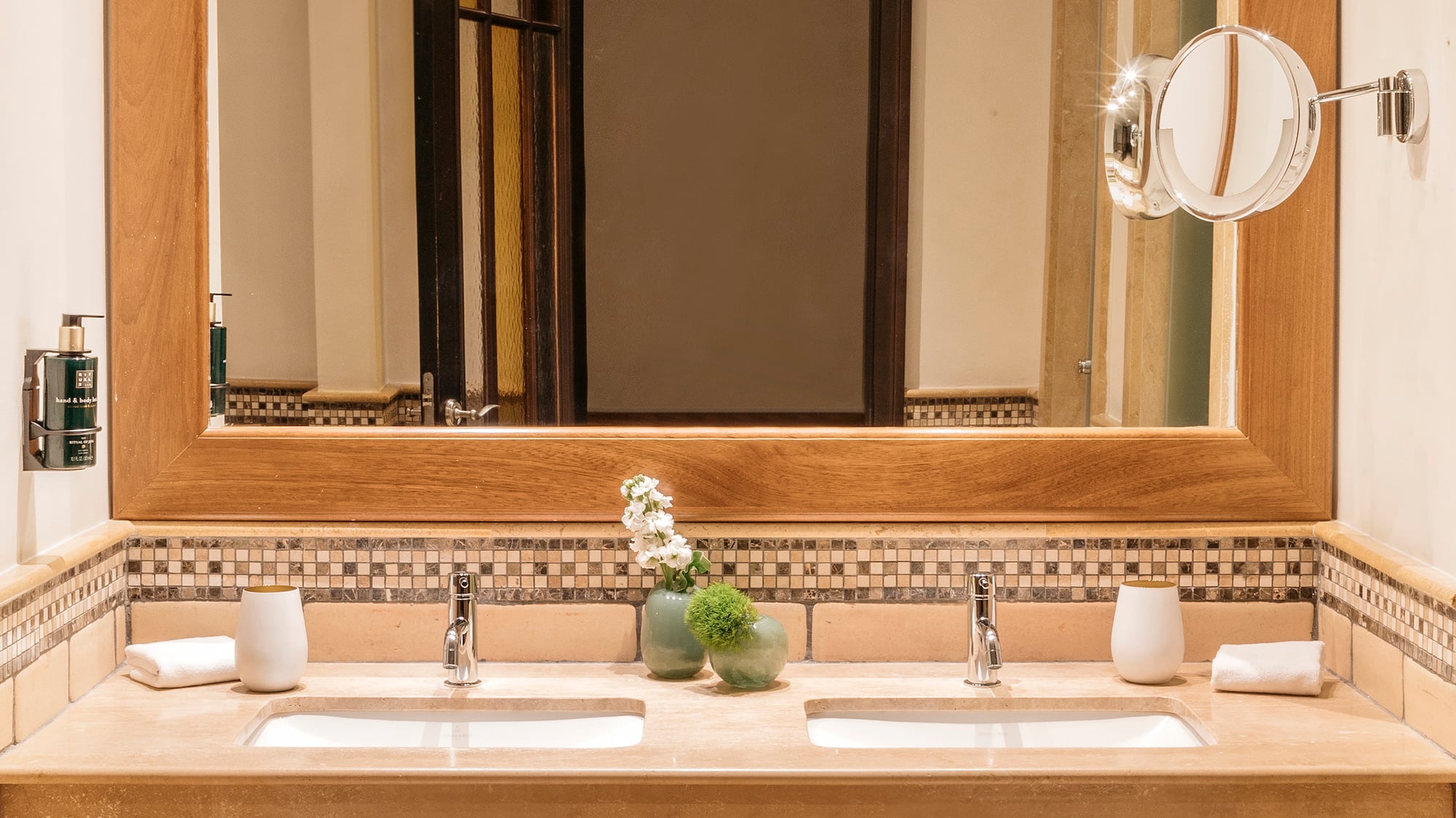 a bathroom with a mirror and sinks
