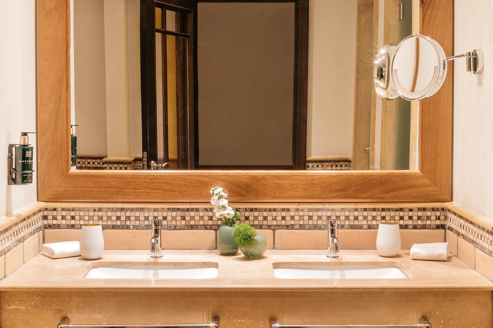 a bathroom with a mirror and sinks