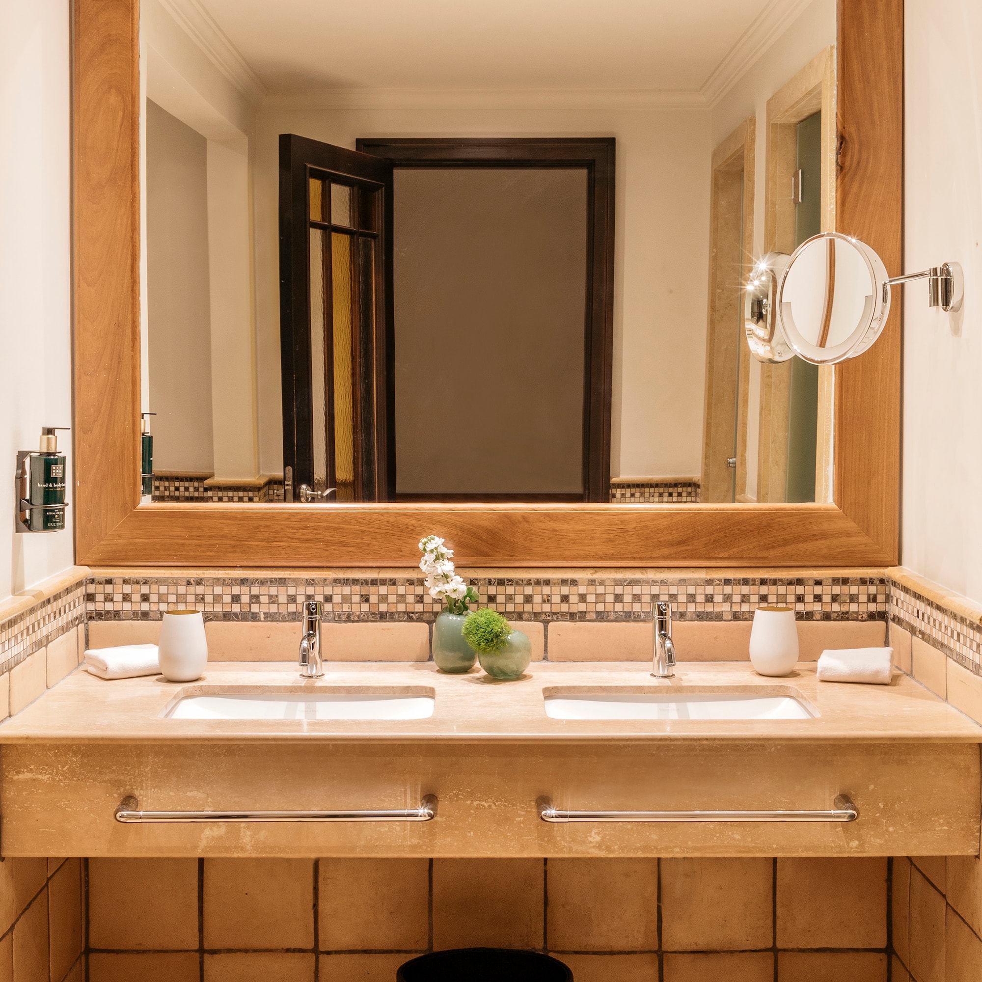 a bathroom with a mirror and sinks