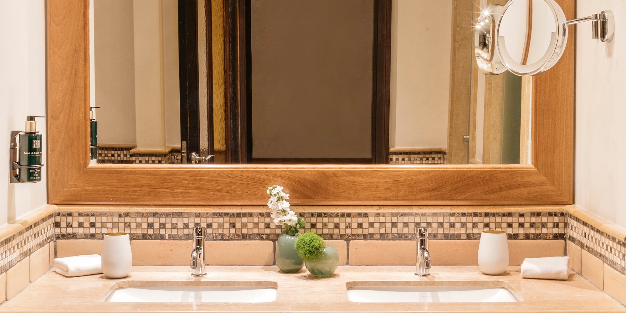 a bathroom with a mirror and sinks