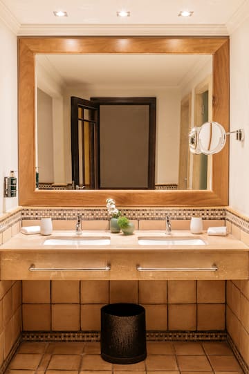 a bathroom with a mirror and sinks