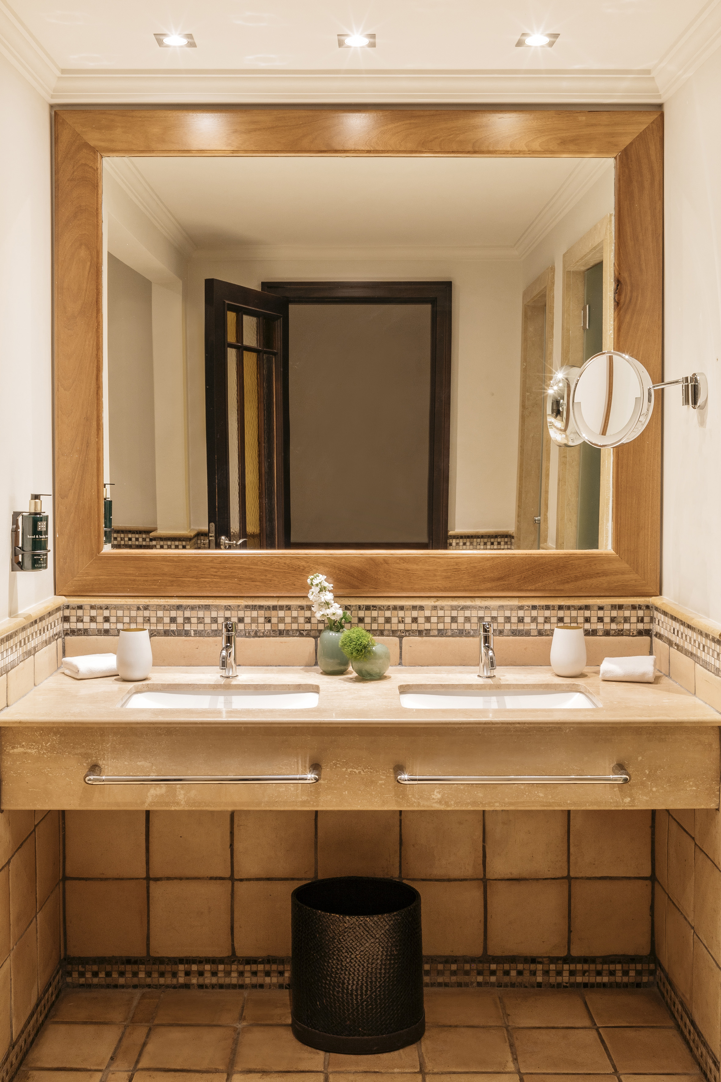 a bathroom with a mirror and sinks