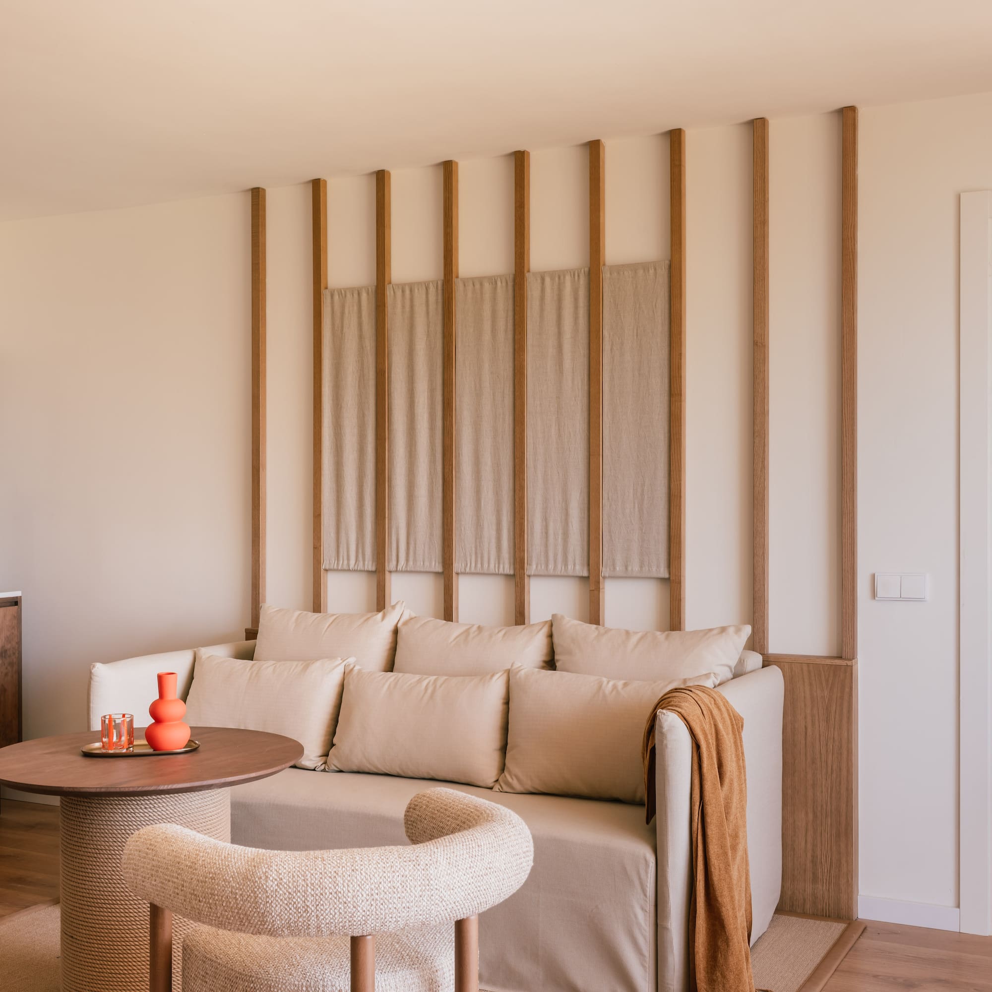 a living room with a couch and a round table