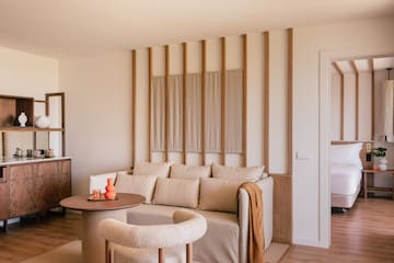 a living room with a couch and a round table