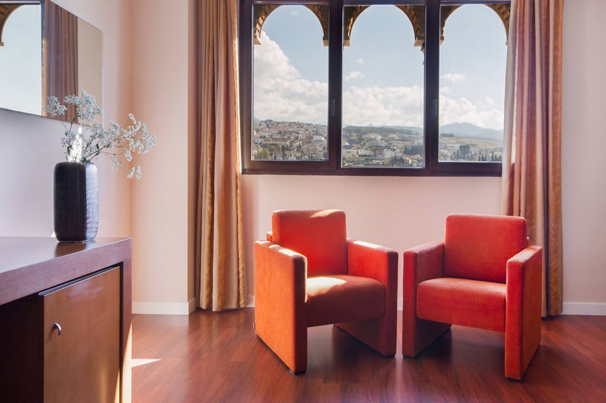 two chairs in a room with a window