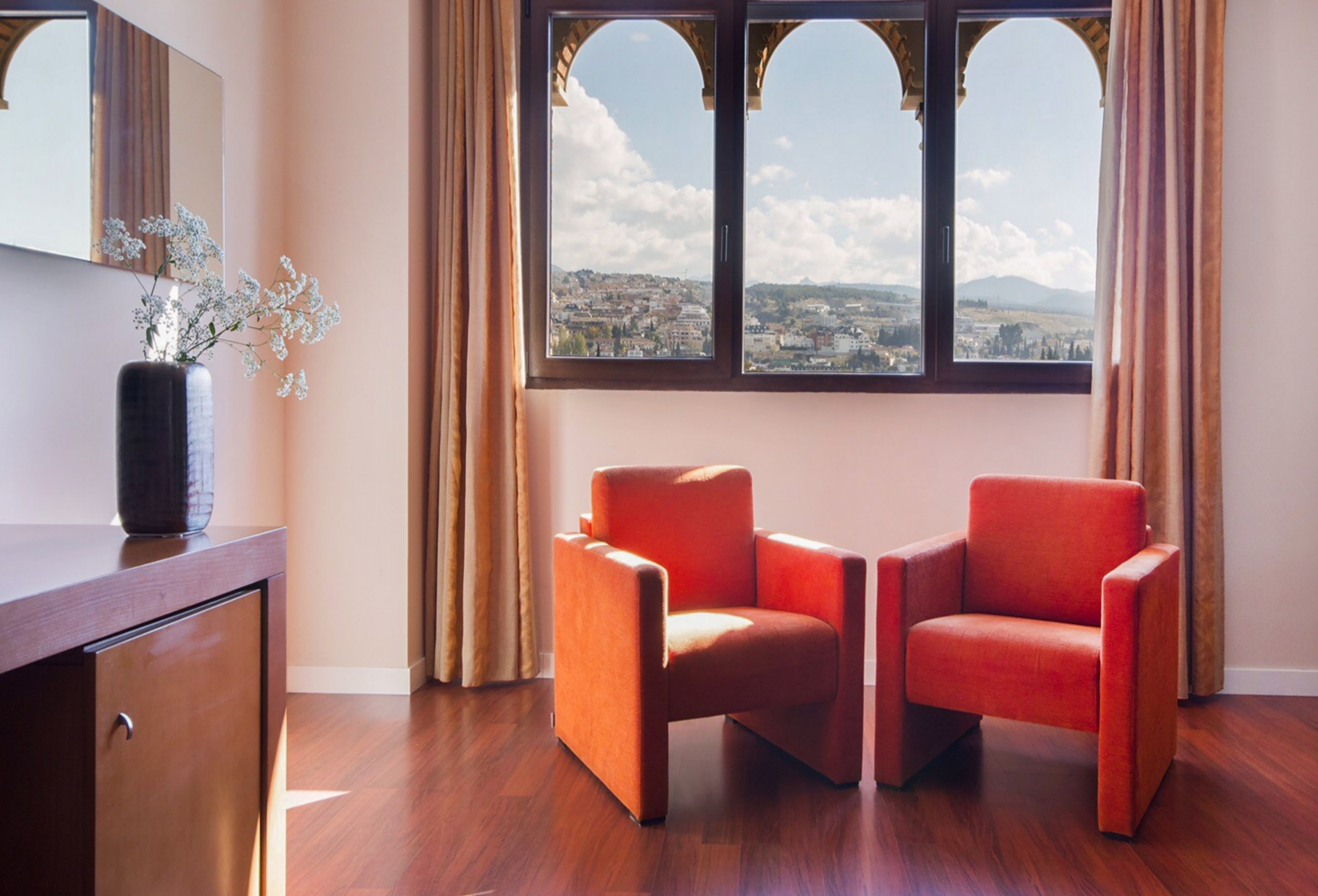 two chairs in a room with a window