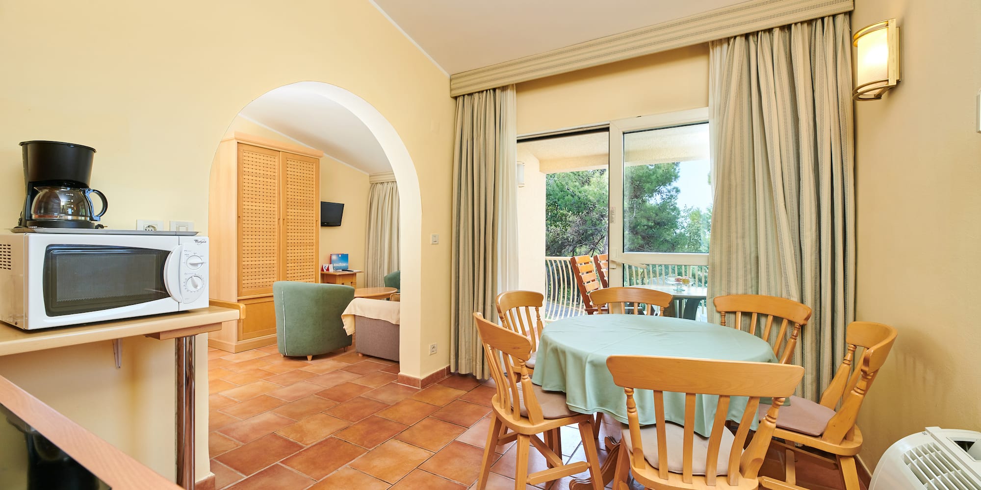 a room with a table and chairs