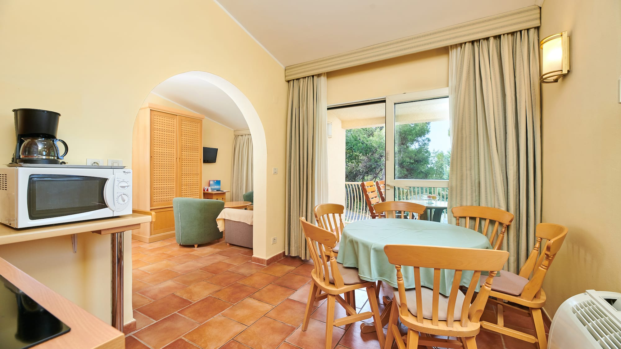 a room with a table and chairs