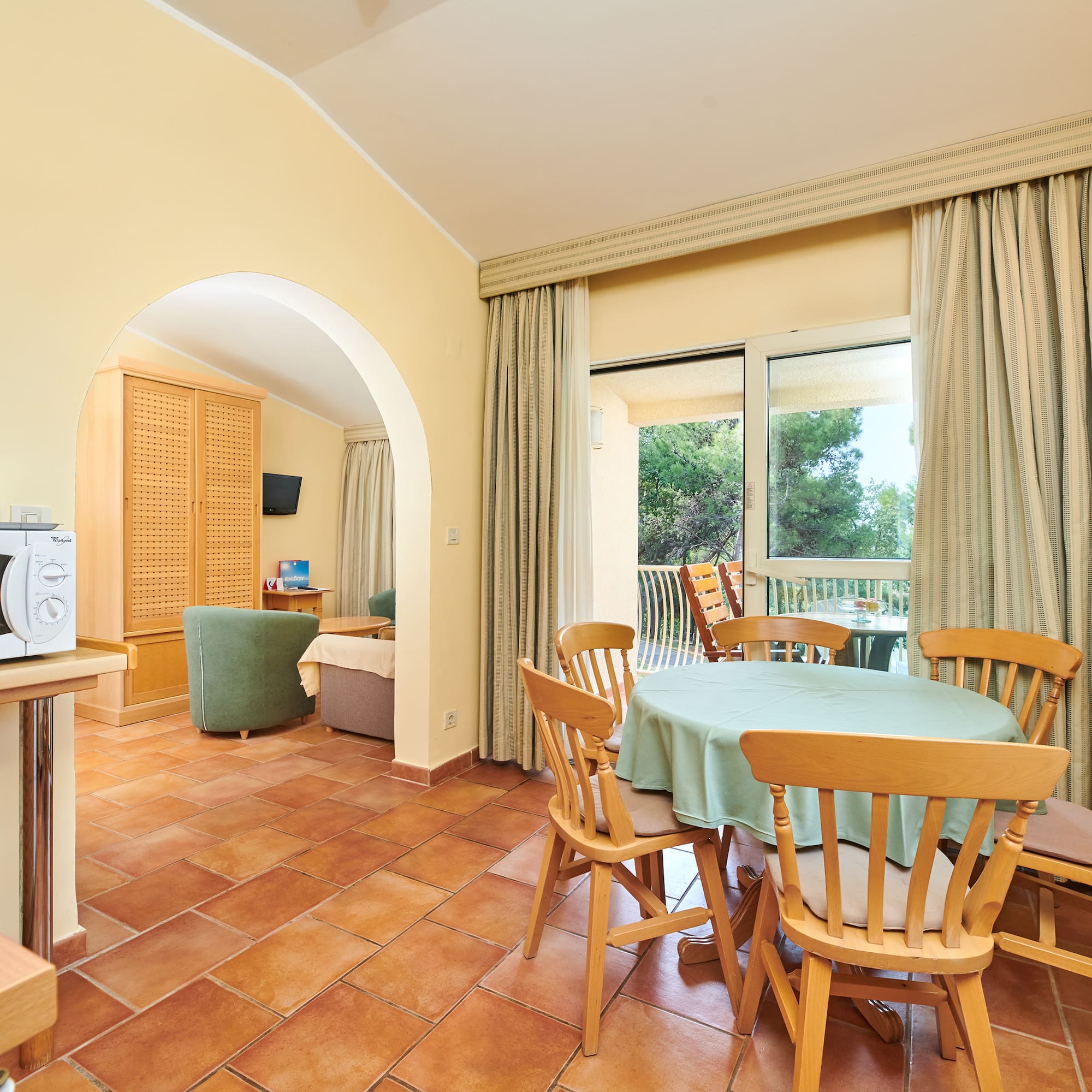 a room with a table and chairs