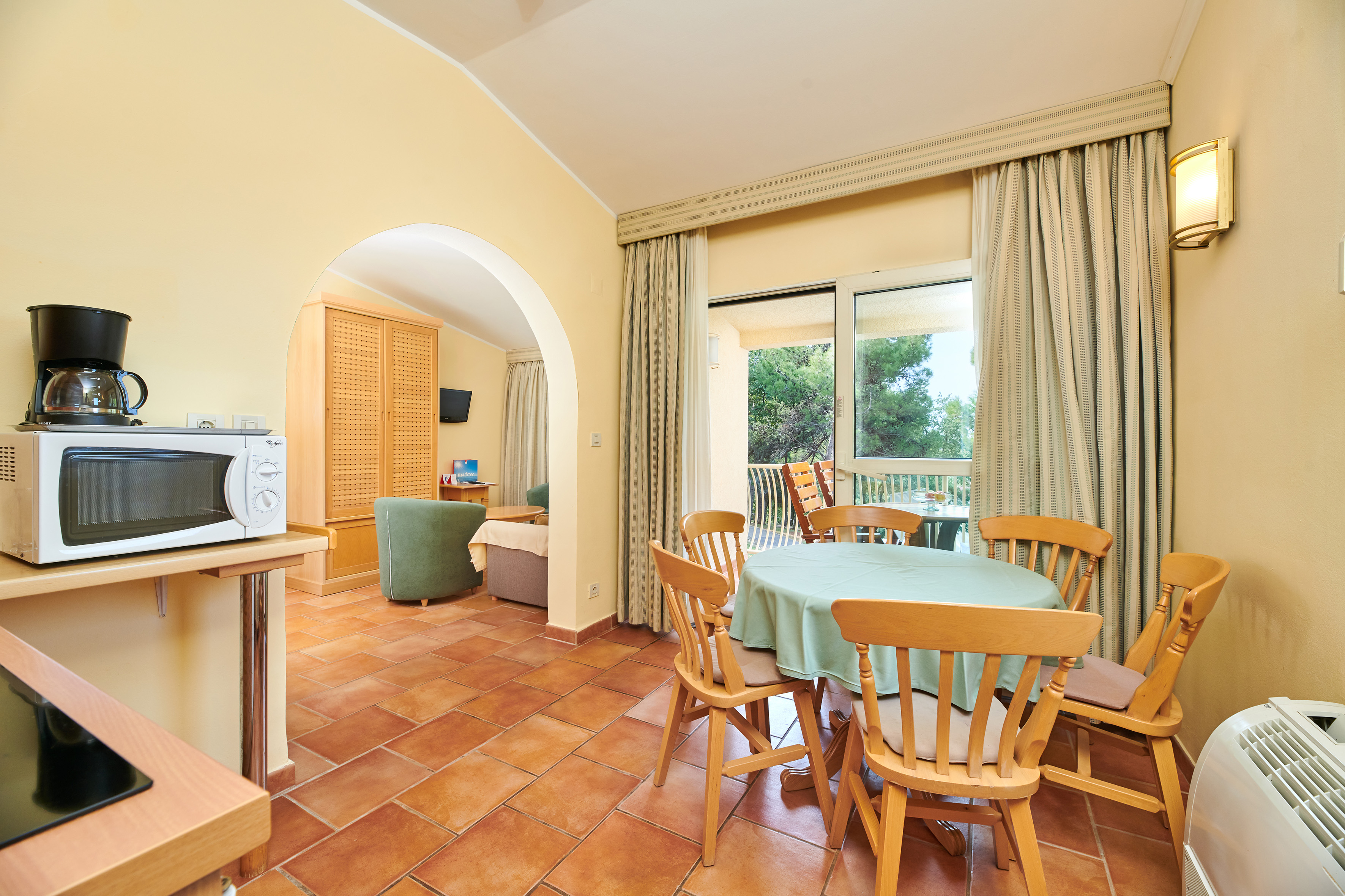 a room with a table and chairs