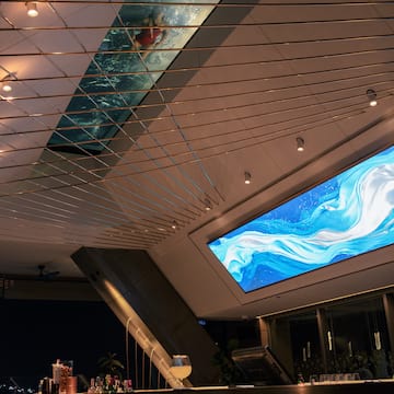 a bar with a large screen