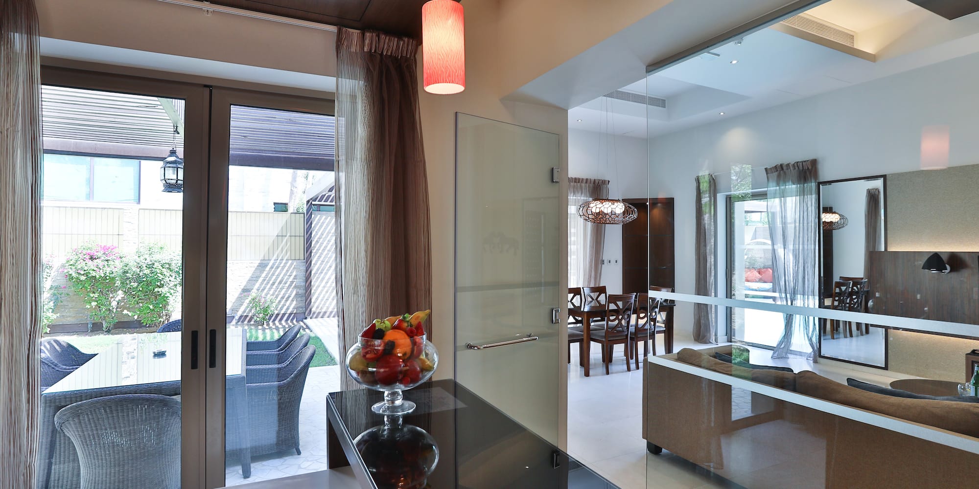 a room with a glass door and a glass wall