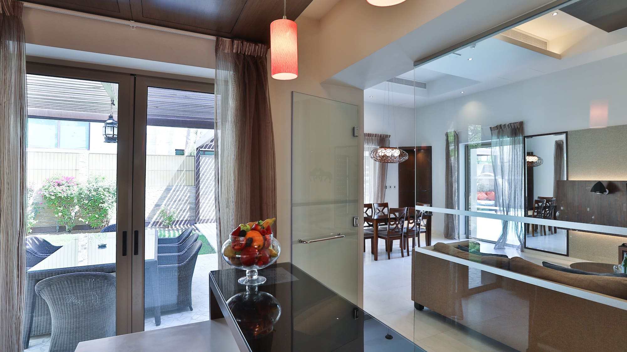 a room with a glass door and a glass wall