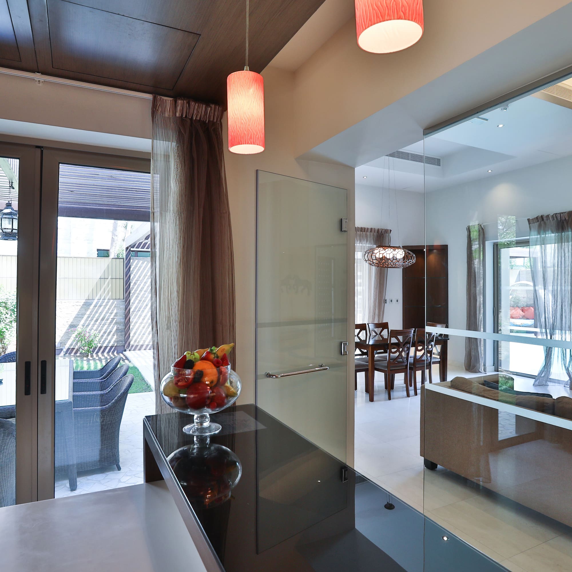 a room with a glass door and a glass wall