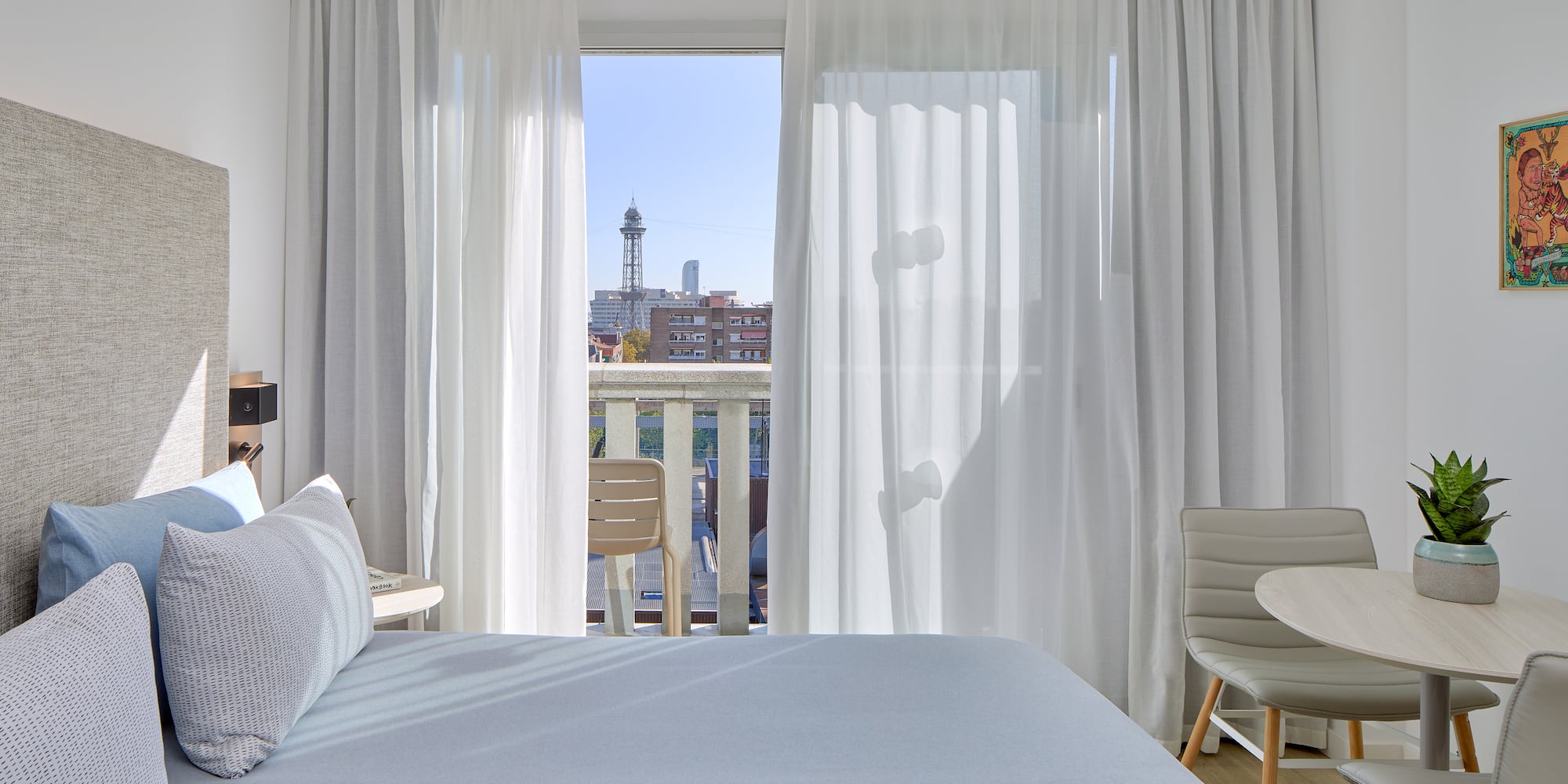 a bedroom with a table and chairs and a table and chairs