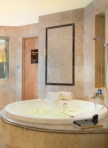 a large bathtub in a bathroom