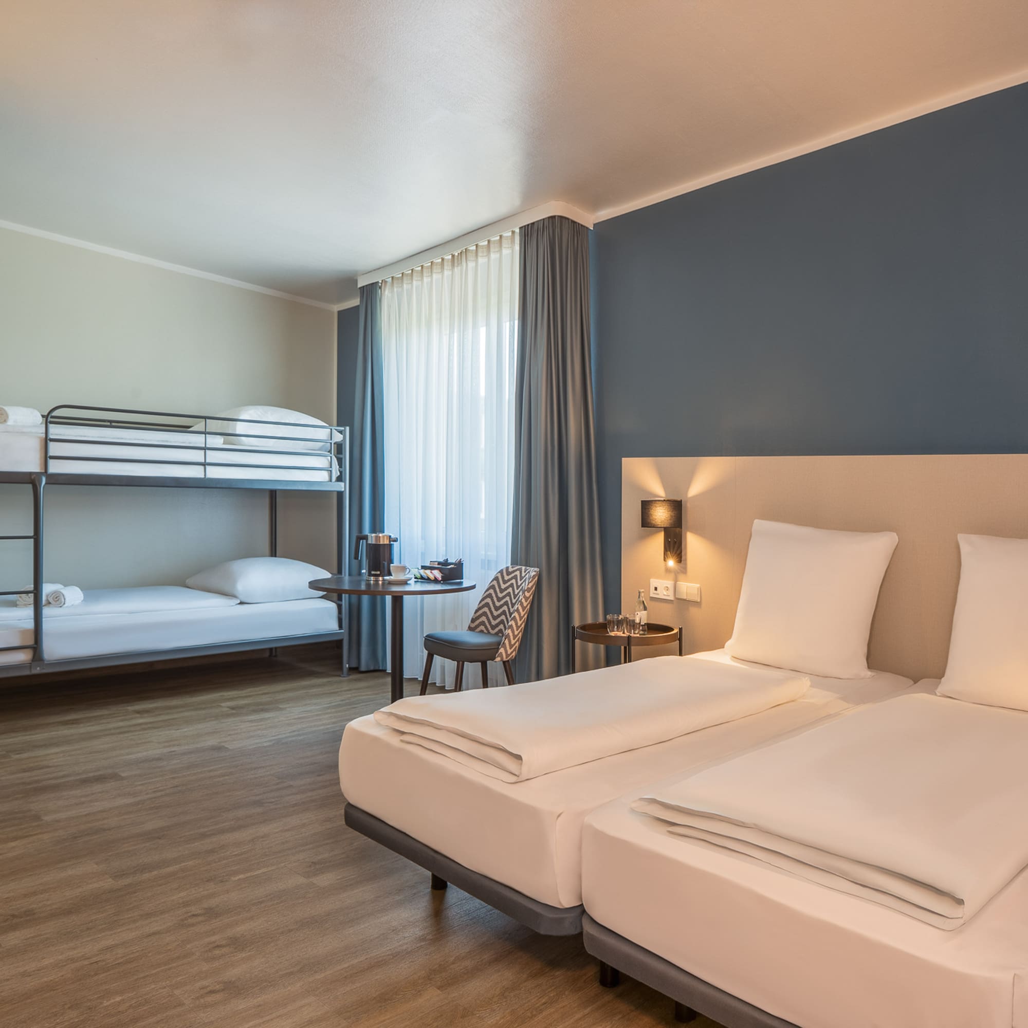 a room with bunk beds and a table