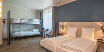 a room with bunk beds and a table