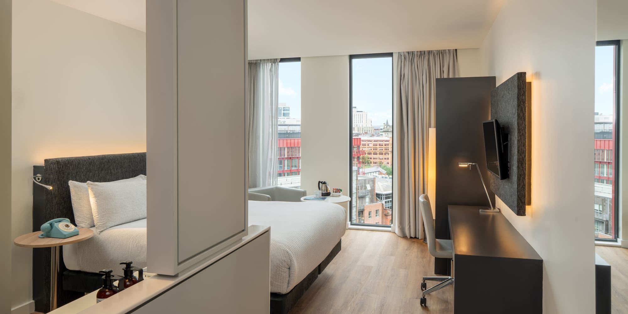 a room with a bed and a desk