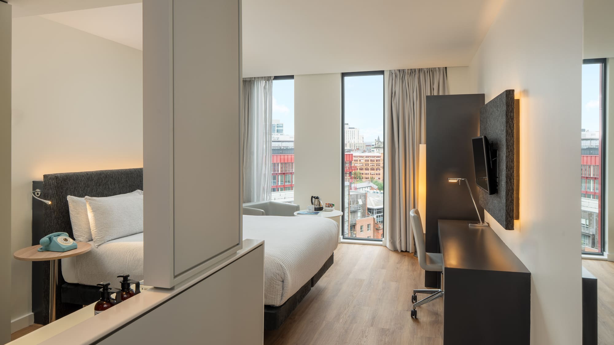 a room with a bed and a desk