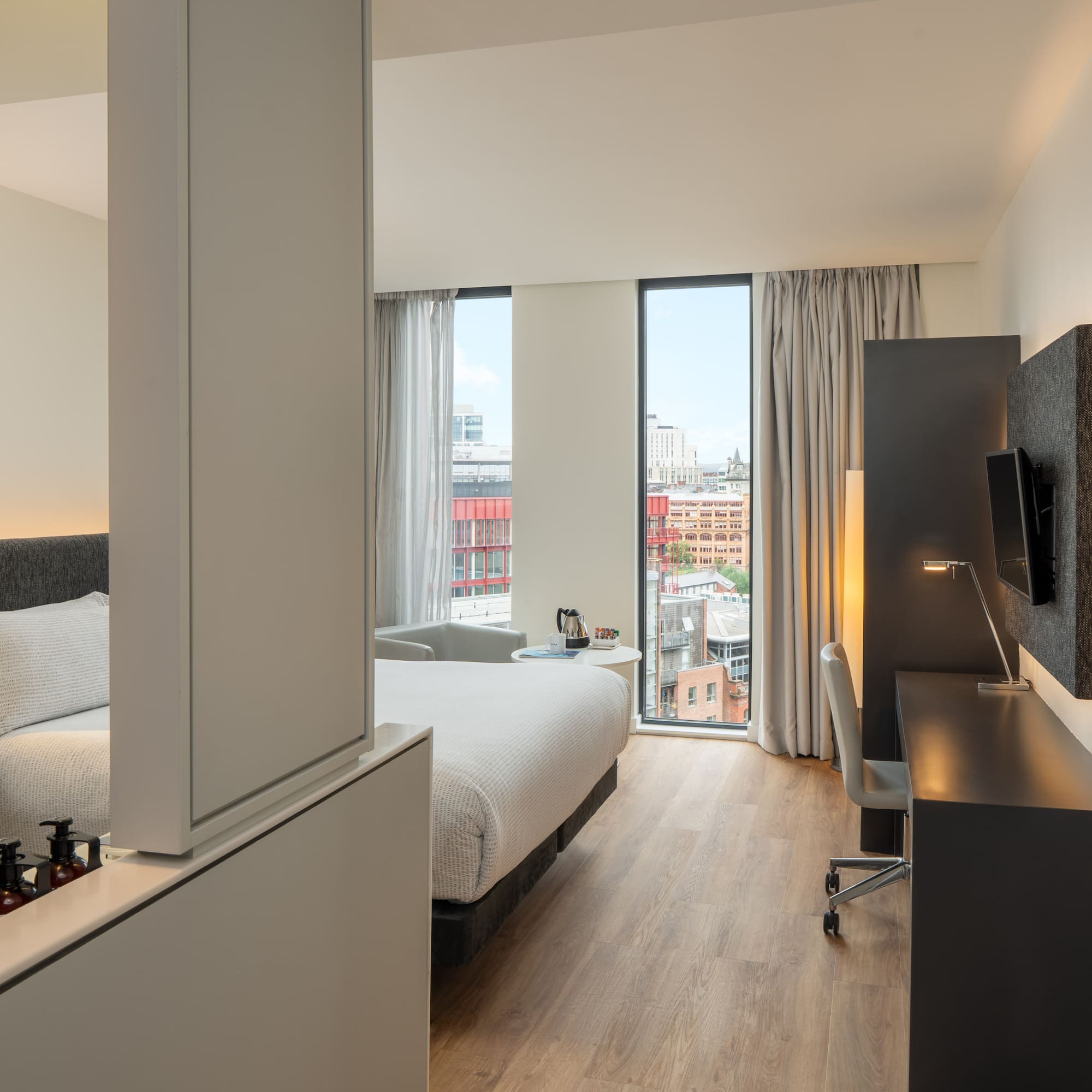 a room with a bed and a desk