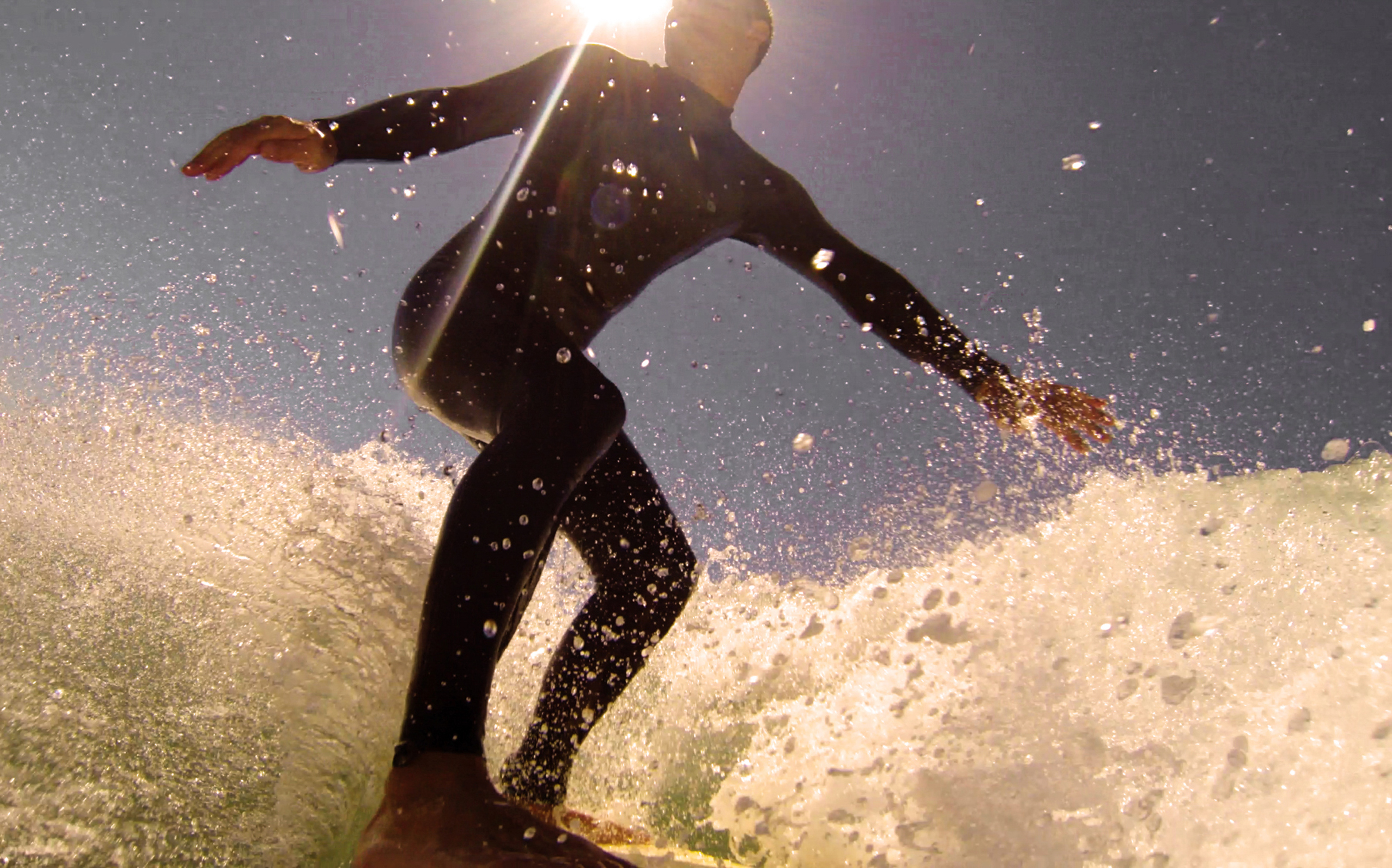 a man surfing on a wave