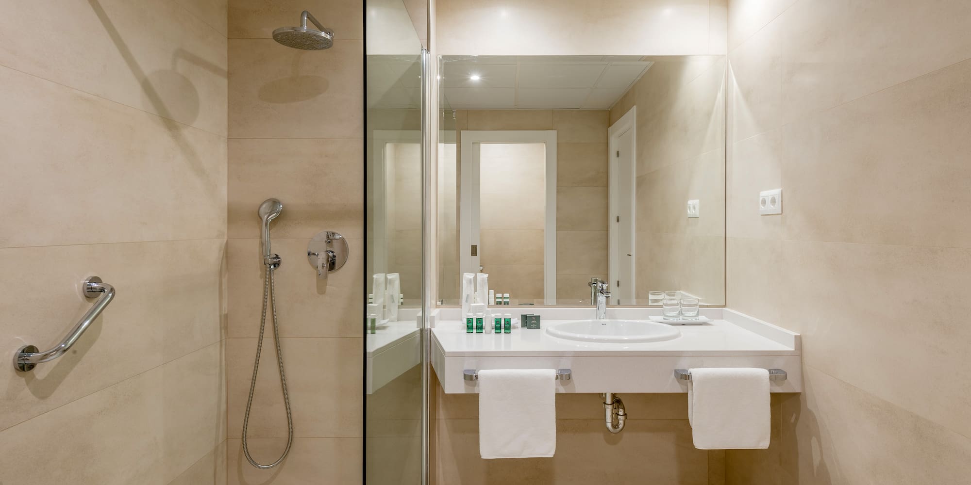 a bathroom with a shower and sink