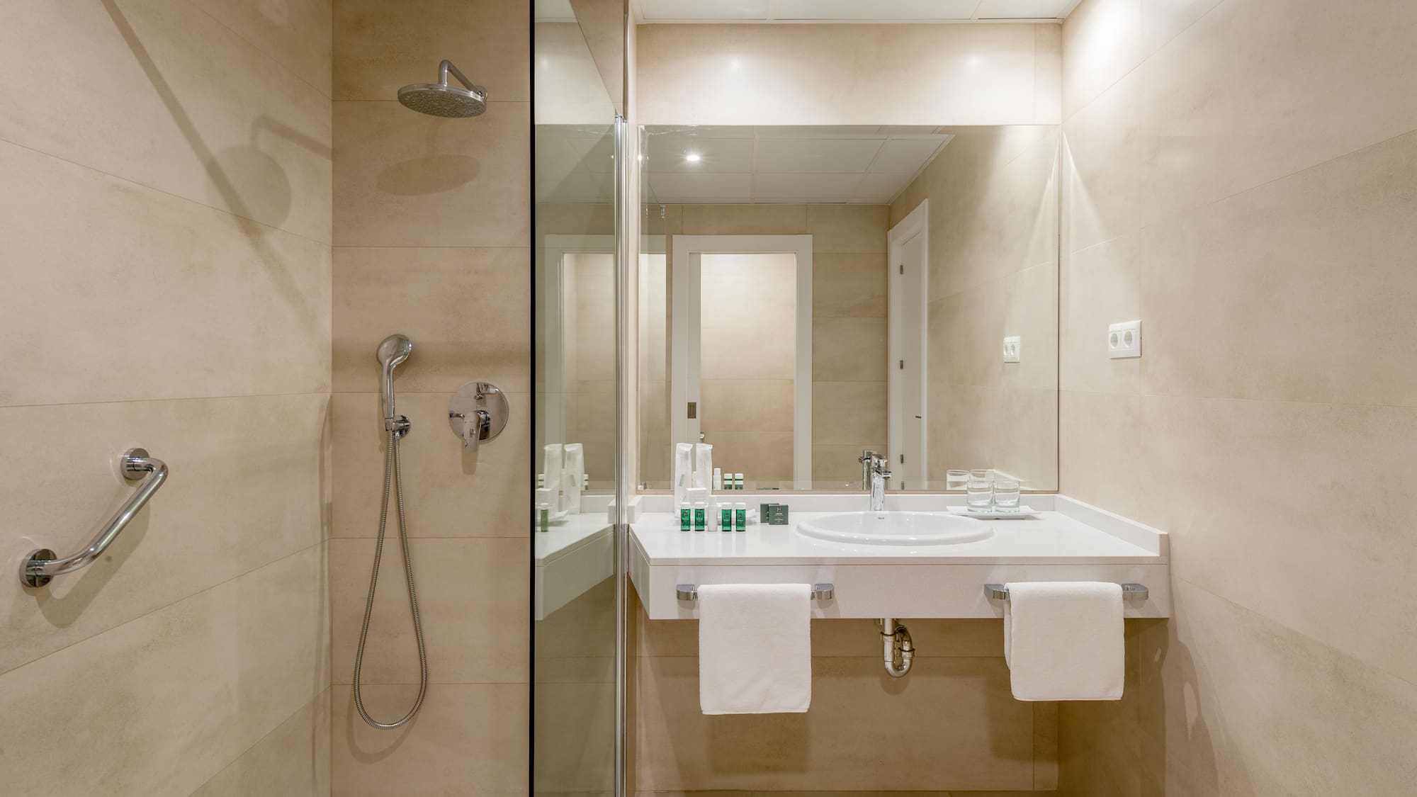 a bathroom with a shower and sink