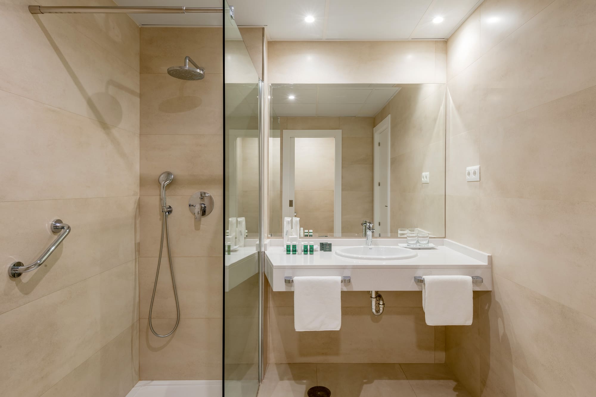 a bathroom with a shower and sink