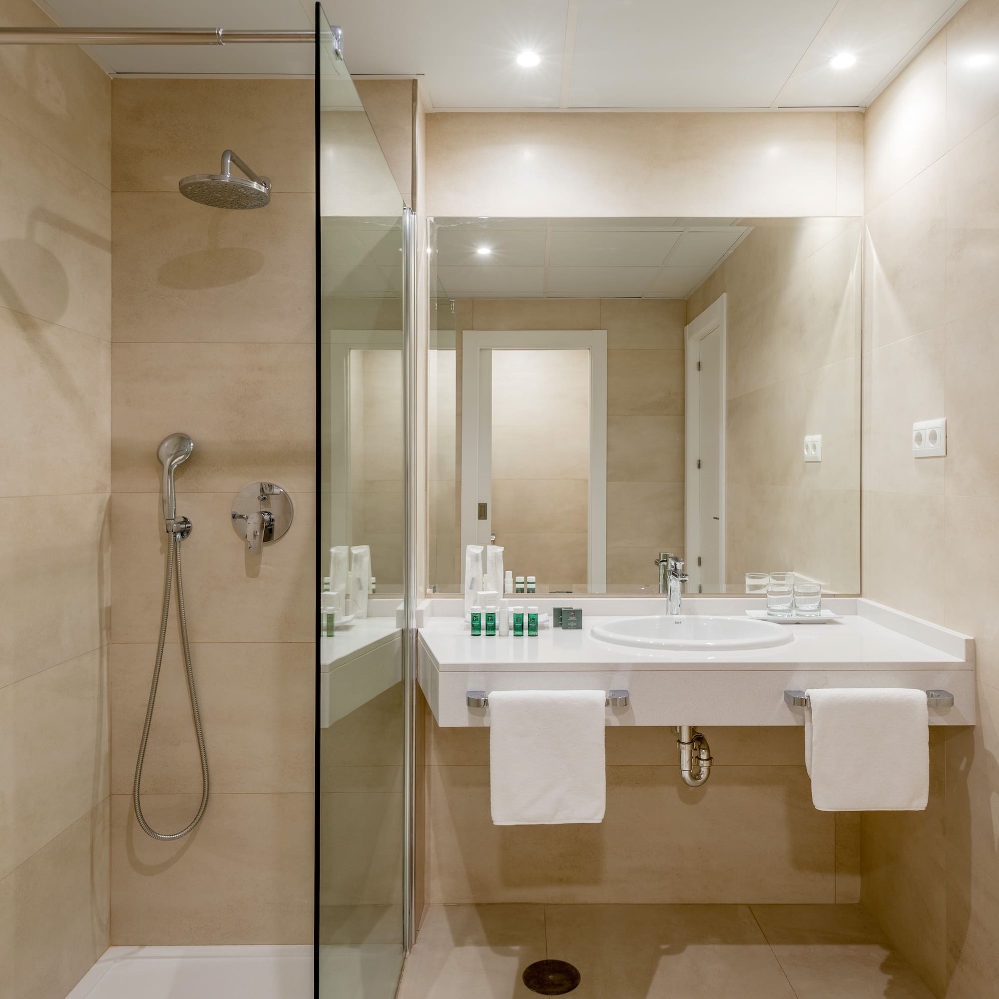 a bathroom with a shower and sink