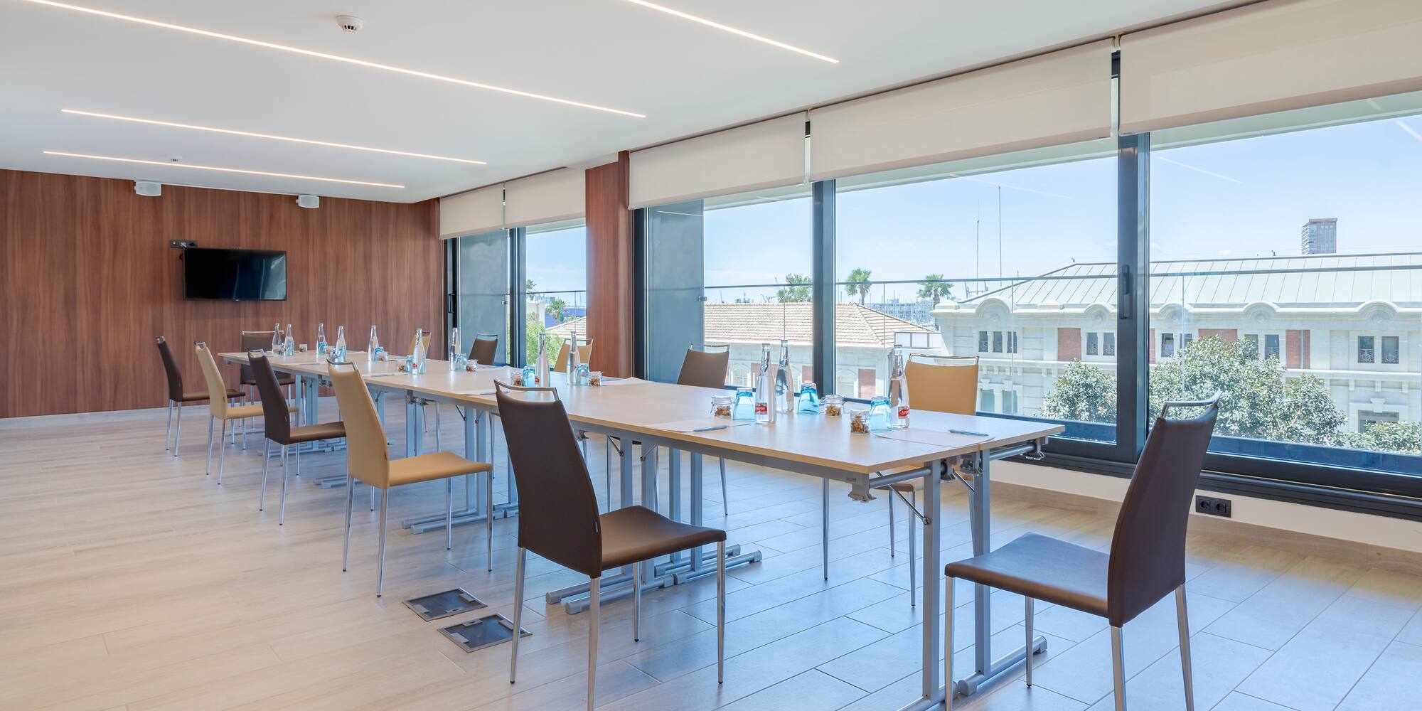 a room with a long table and chairs