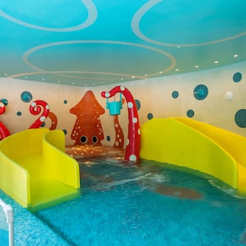 a water slide in a pool