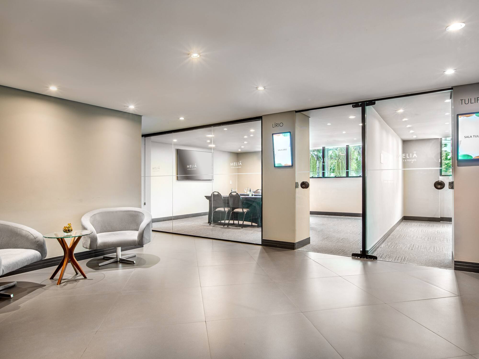 a room with glass walls and a chair