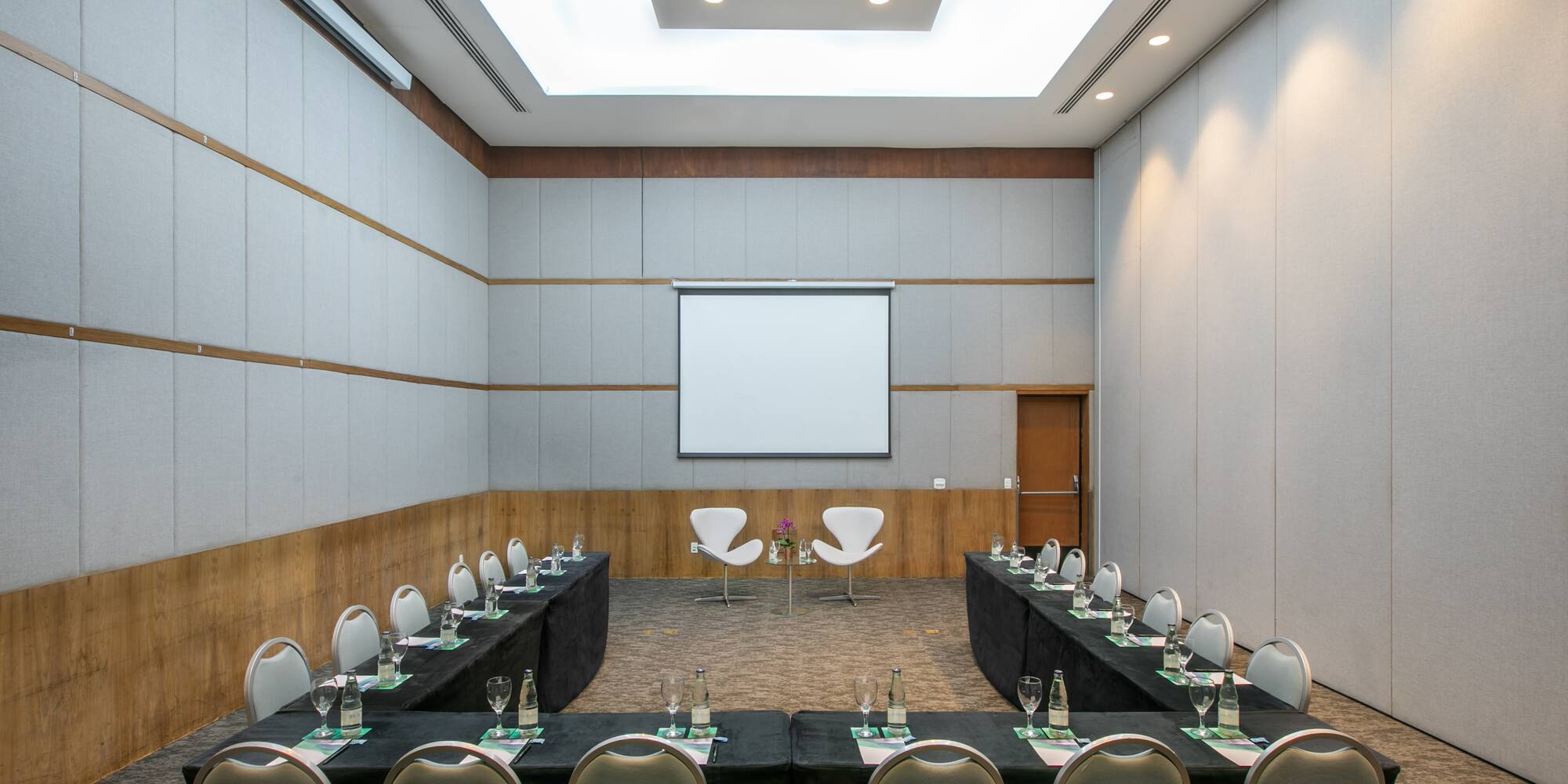 a room with a large table and chairs