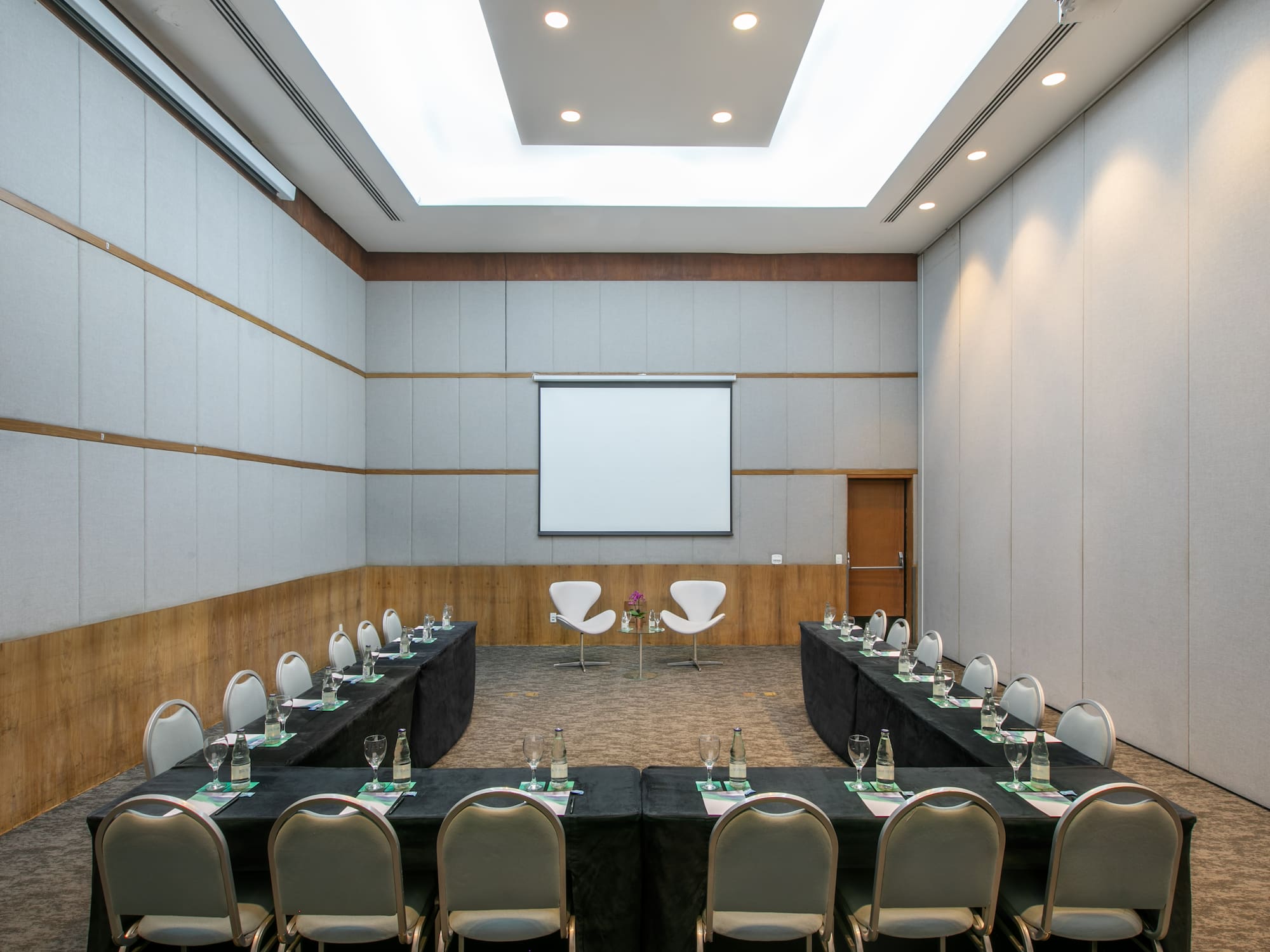 a room with a large table and chairs