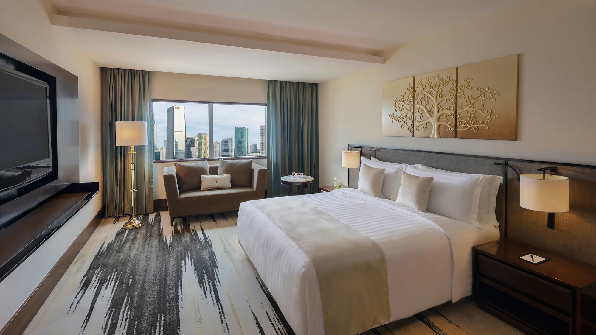 a hotel room with a large bed and a couch